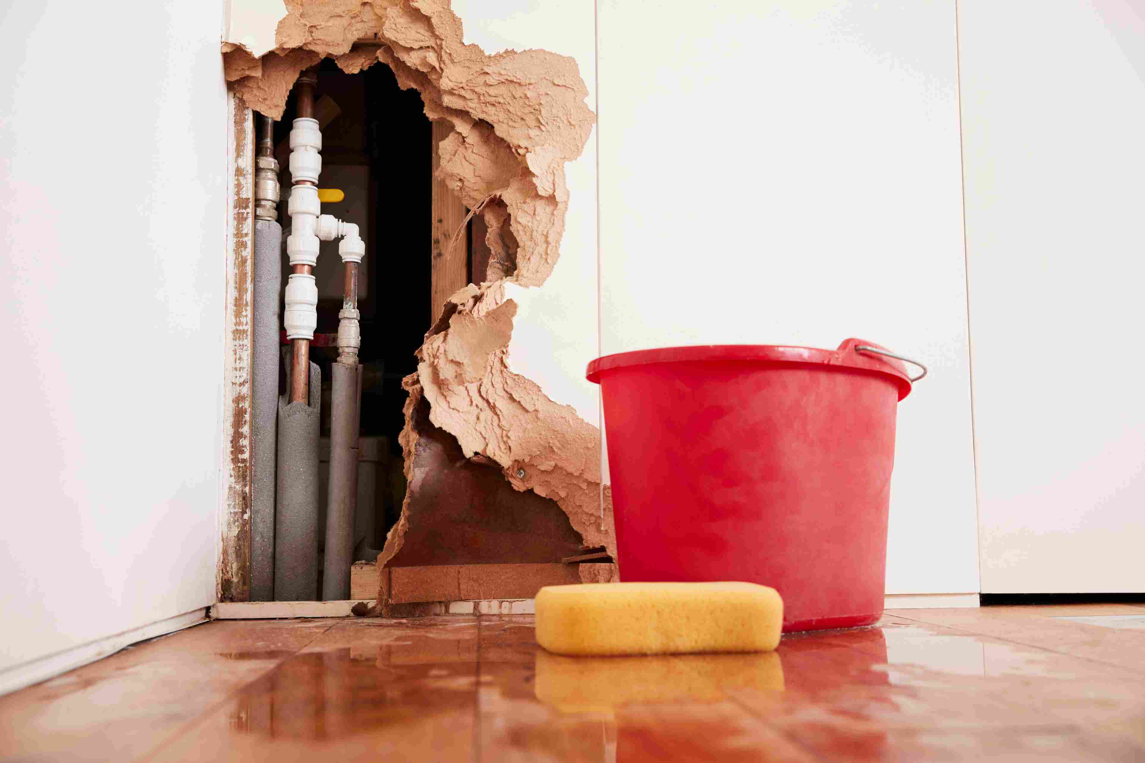 damaged-wall-exposed-burst-water-pipes-sponge-an damaged-wall-exposed-burst-water-pipes-sponge-an